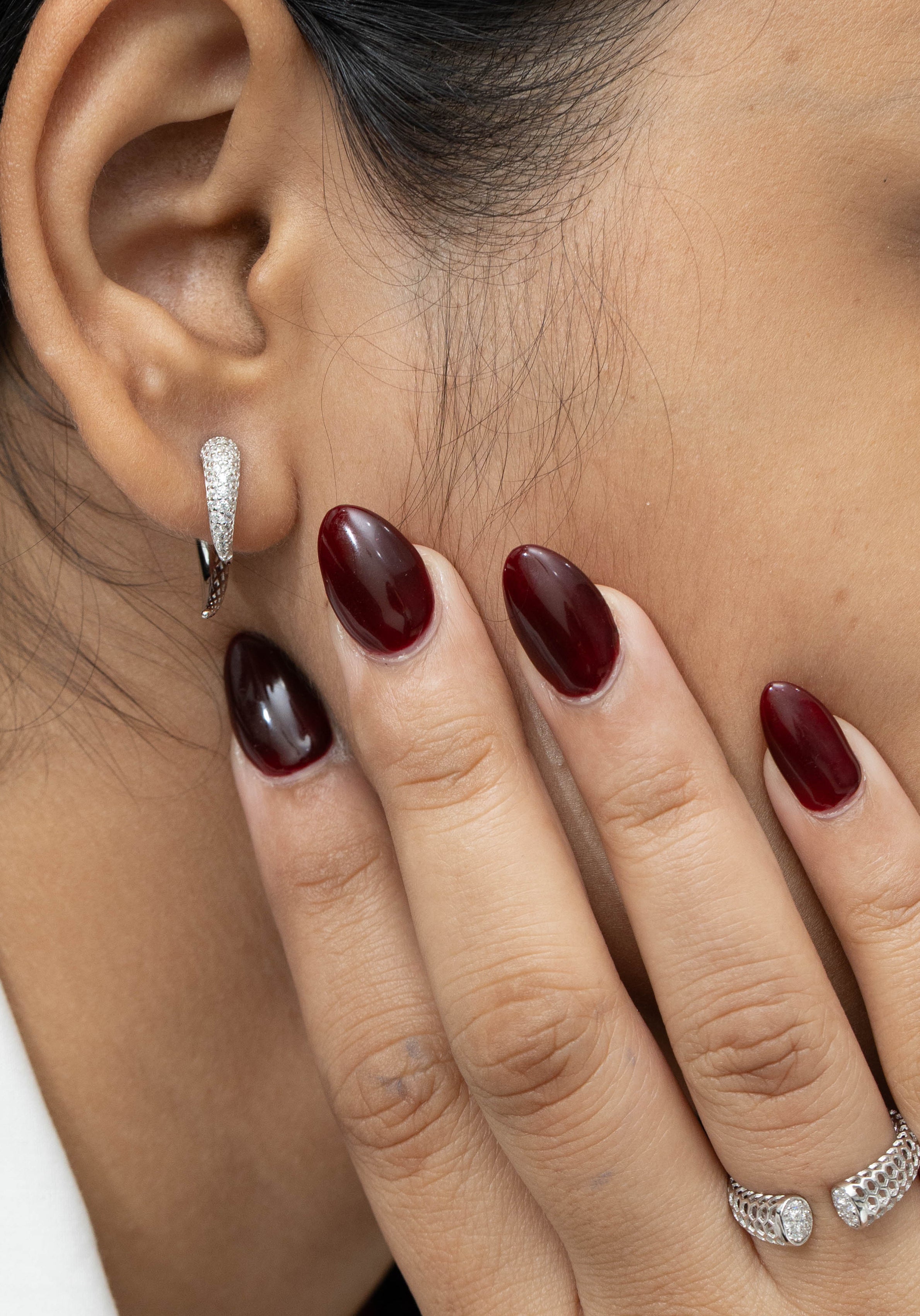 Sculptural tusk earrings in minimalist luxury style