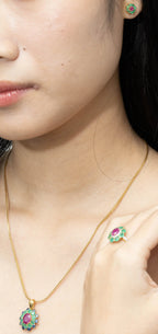 Gold necklace, ring, and earring set with ruby, emerald, and sapphire gemstones