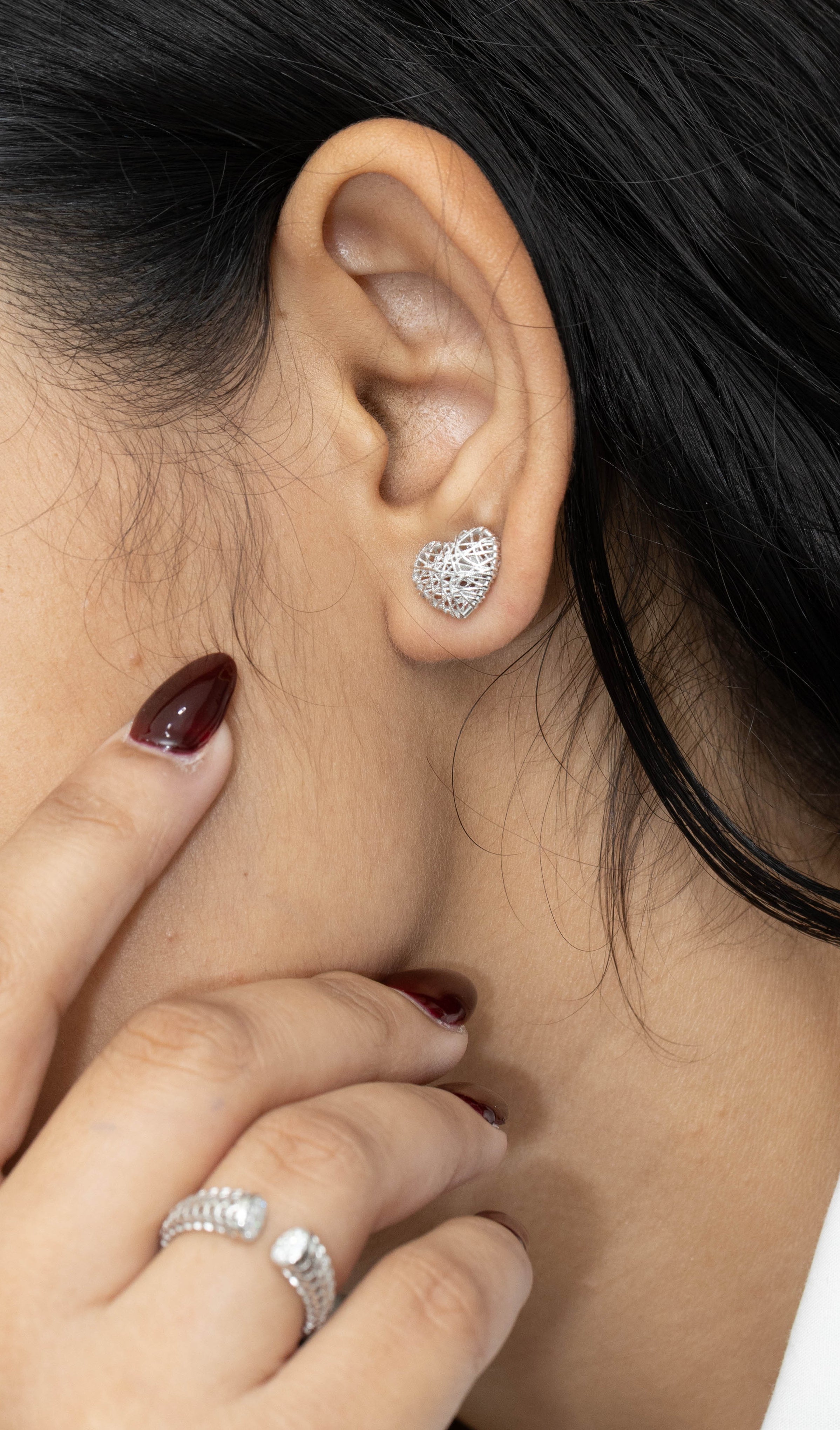 Contemporary silver heart stud earrings for women