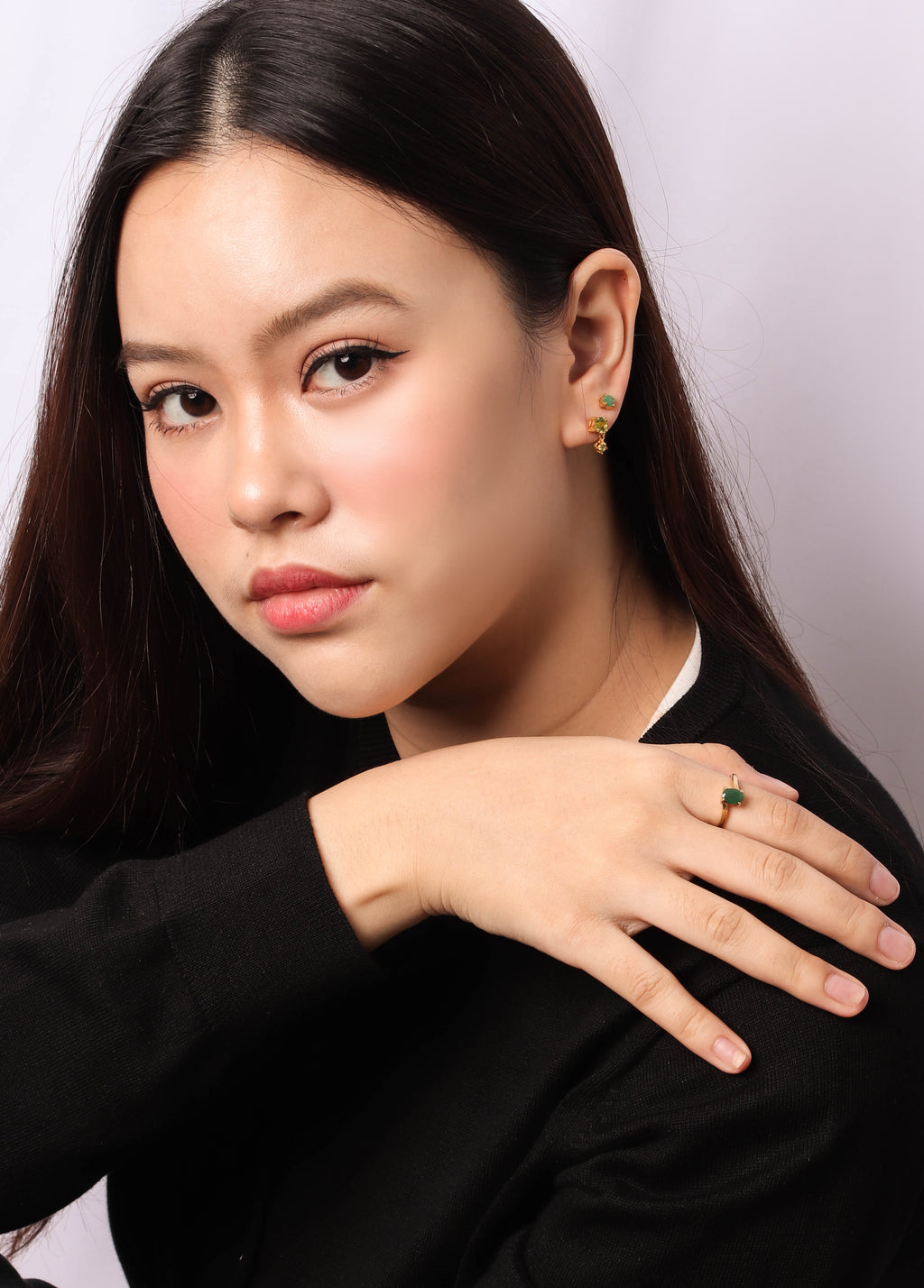 Unique ring with emerald gemstone and refined sterling silver ring finish