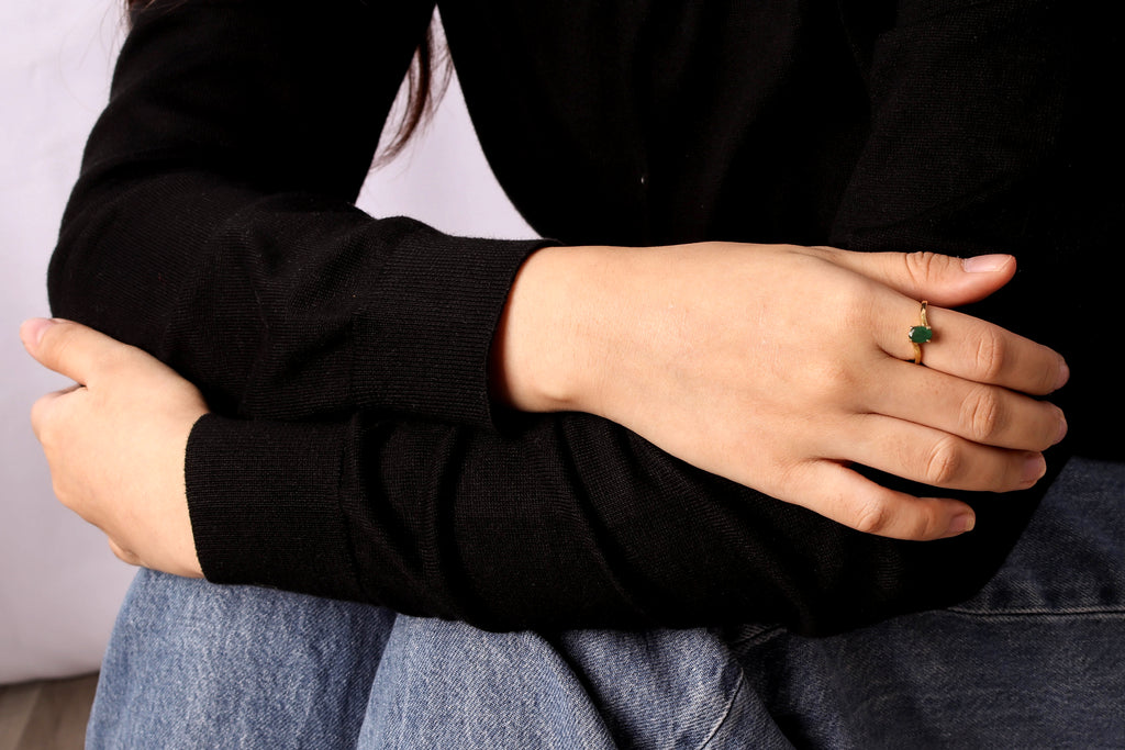 Birthstone ring featuring green emerald in a simple dainty ring design