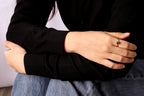 Birthstone ring featuring green emerald in a simple dainty ring design