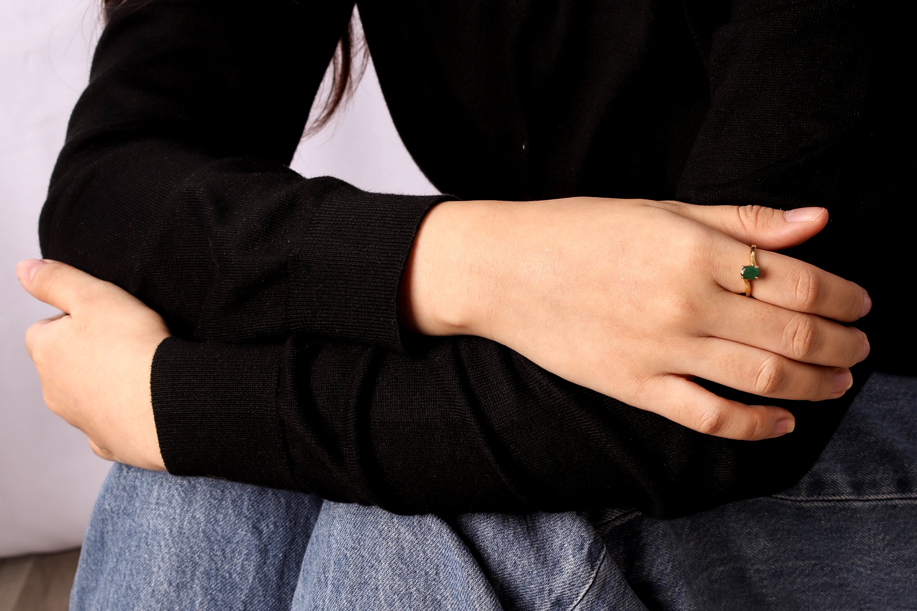 Birthstone ring featuring green emerald in a simple dainty ring design
