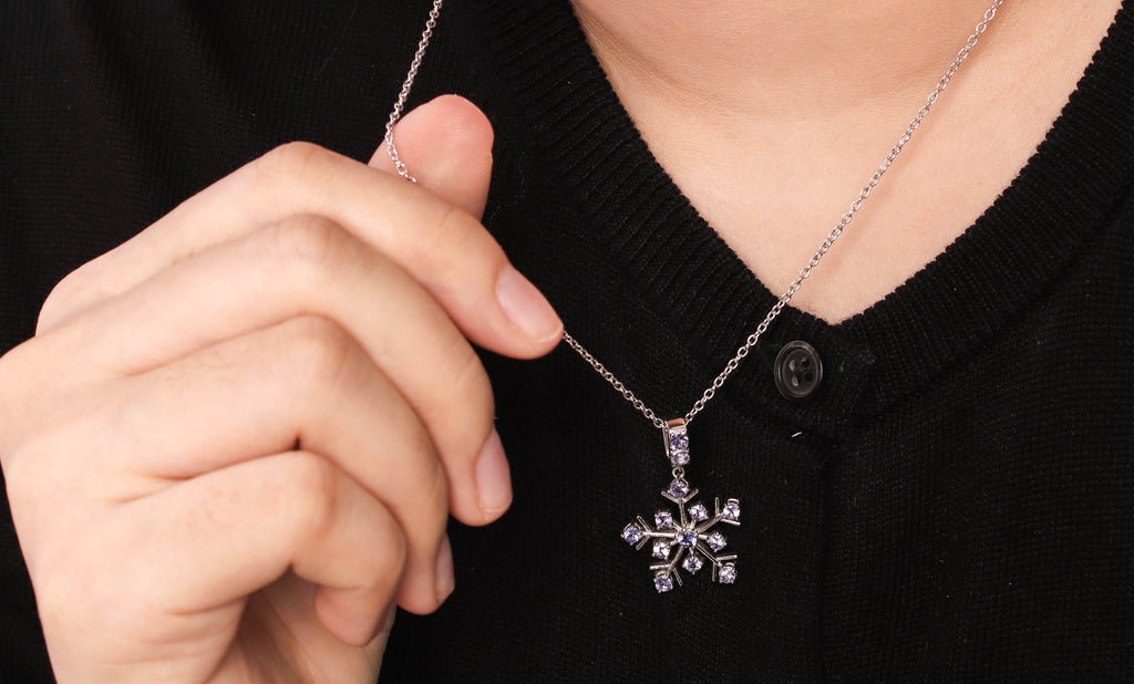 Blue-violet tanzanite snowflake necklace charm — front view