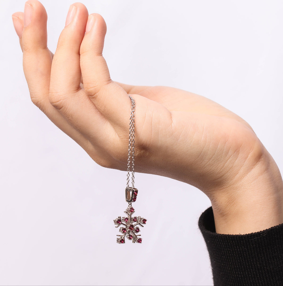 Pink tourmaline snowflake necklace charm — front view