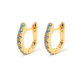 Blue topaz huggie hoop earrings in 18K gold plated sterling silver by Jewelry By Crimson