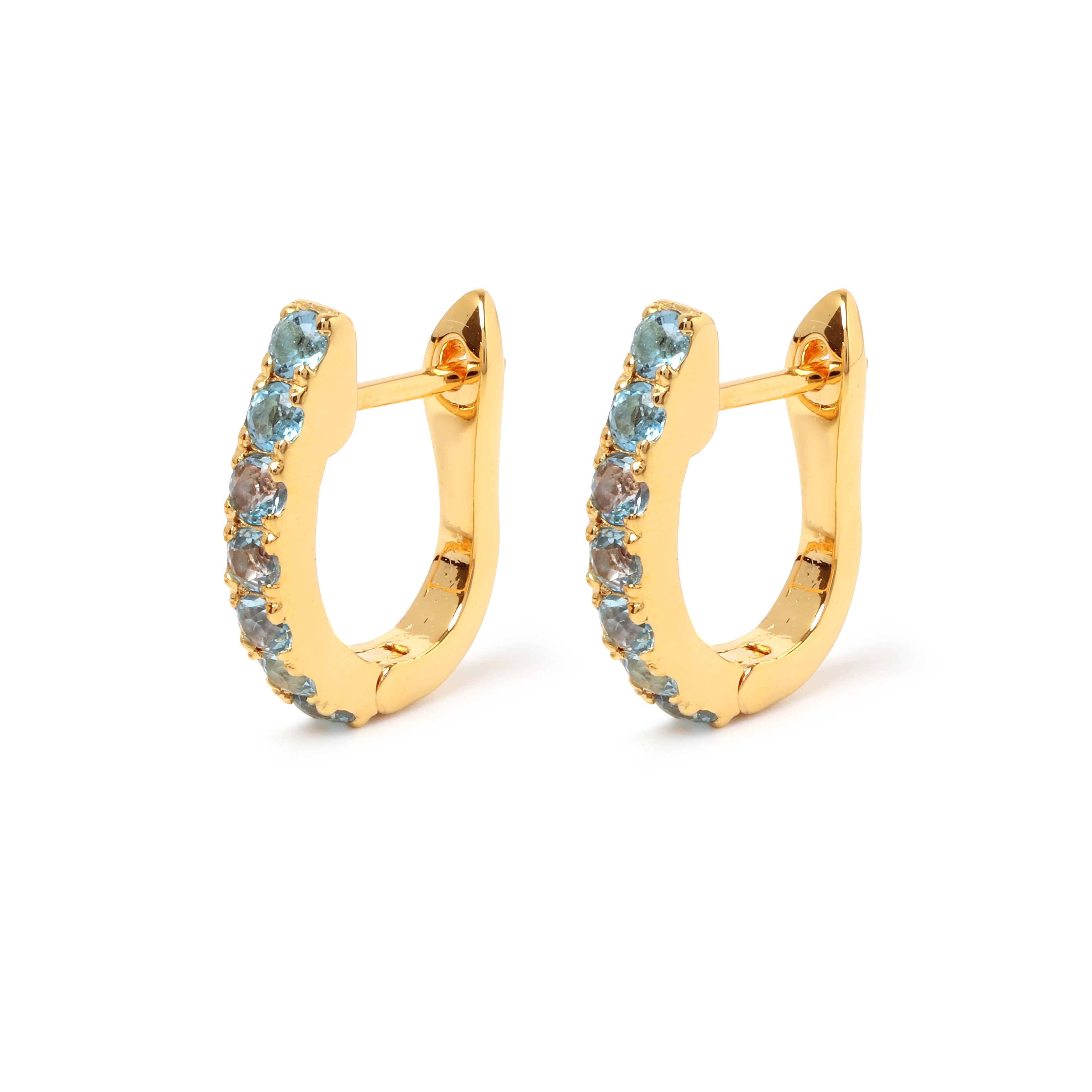 Blue topaz huggie hoop earrings in 18K gold plated sterling silver by Jewelry By Crimson