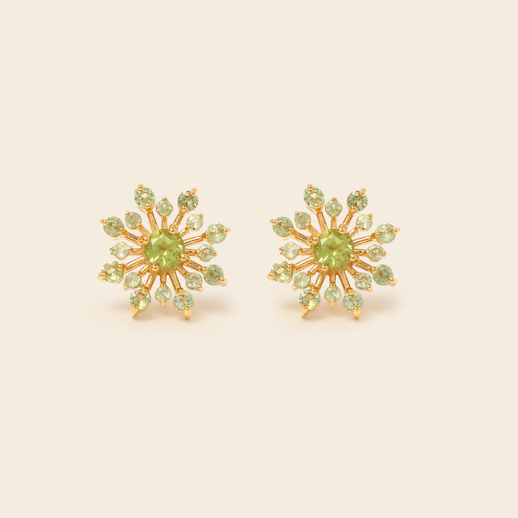 Peridot snowflake studs in 18K gold — detail view