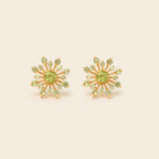Peridot snowflake studs in 18K gold — detail view