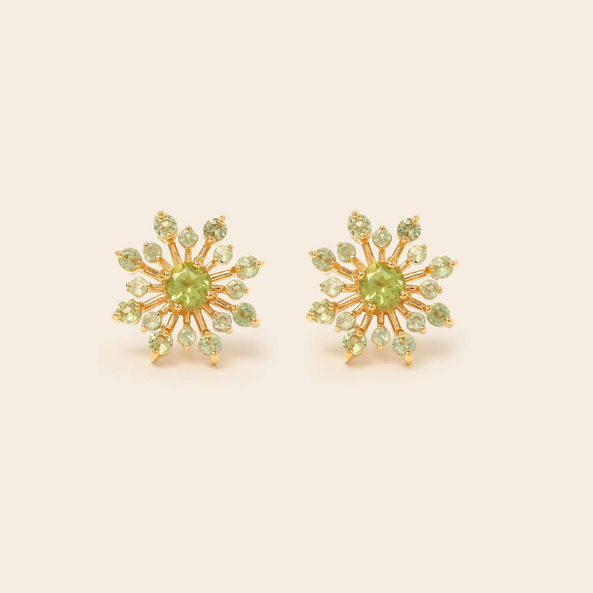 Peridot snowflake studs in 18K gold — detail view