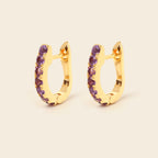 Amethyst gemstone huggie hoops in 18K gold — detail view