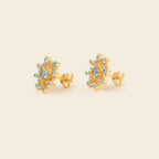 Blue topaz stud earrings with butterfly closure