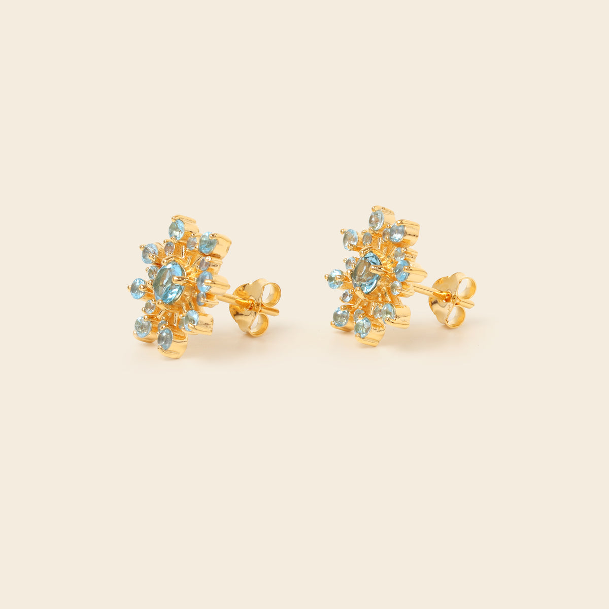 Blue topaz stud earrings with butterfly closure