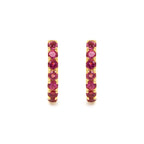 Pink tourmaline gemstone huggie hoops in 18K gold — detail view