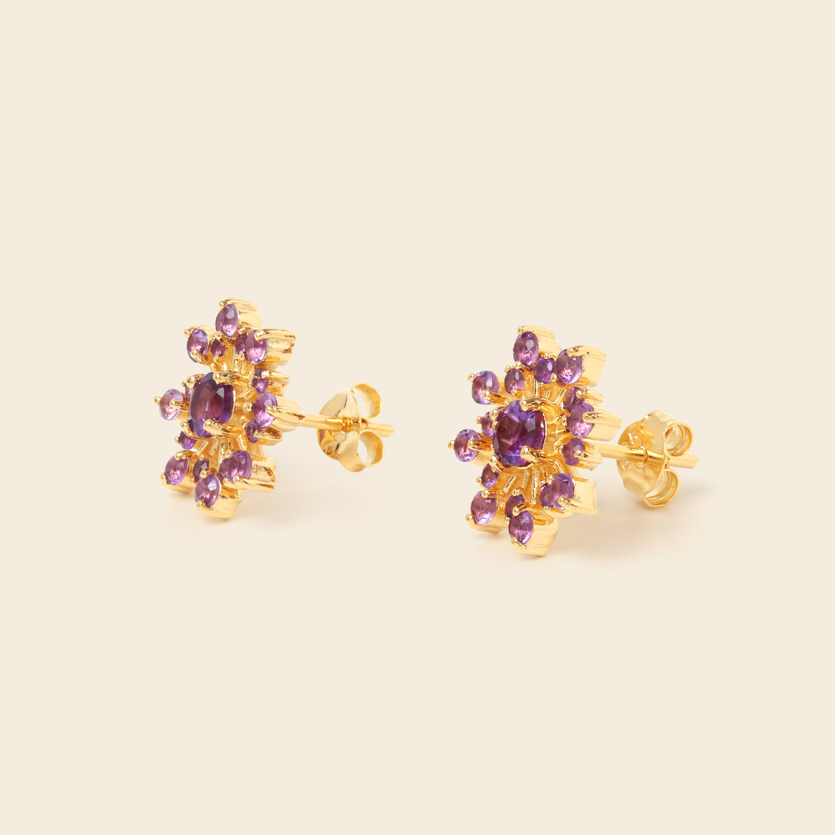 Amethyst snowflake studs in 18K gold — detail view