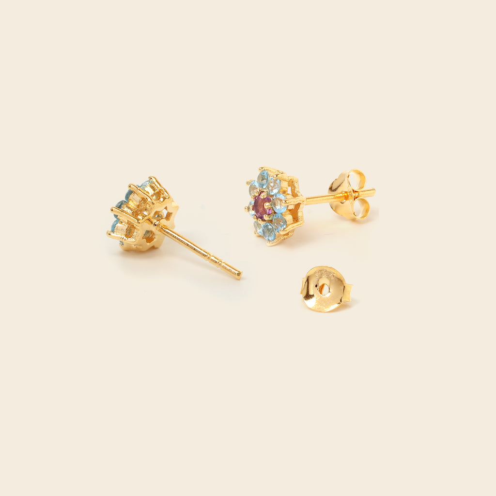 Amethyst and blue topaz floral studs in 18K gold — detail view