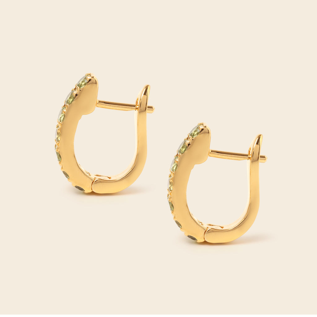 Peridot gemstone huggie hoops in 18K gold — detail view