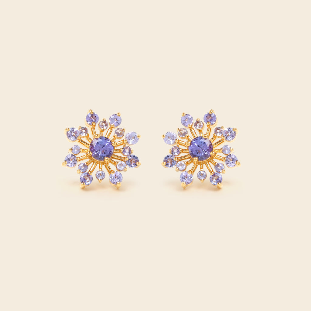 Tanzanite snowflake studs in 18K gold — detail view