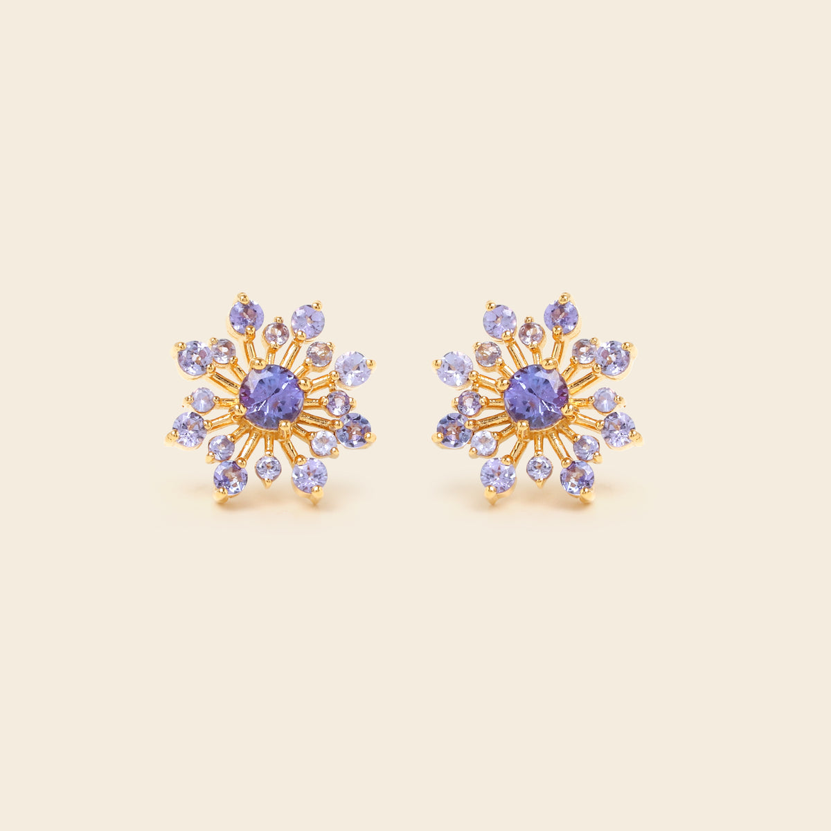 Tanzanite snowflake studs in 18K gold — detail view