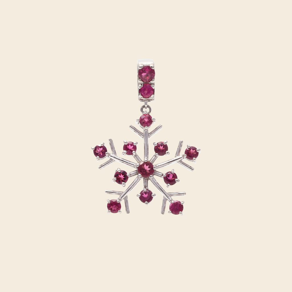 Pink tourmaline gemstone snowflake pendant in sterling silver — side view