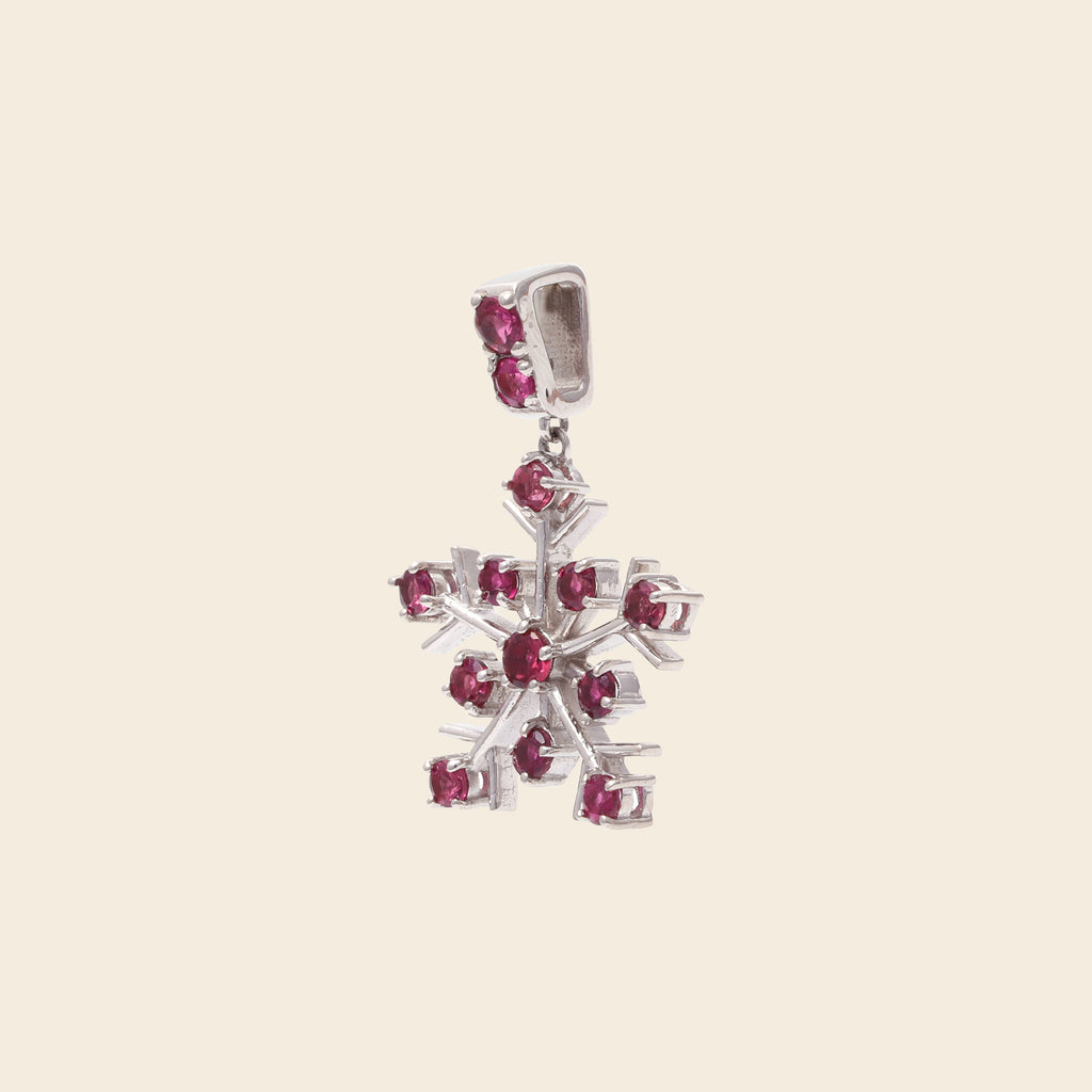 Pink tourmaline snowflake pendant in polished silver — detail view