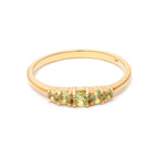 Round peridot five stone band ring in gold — detail view