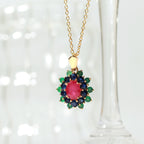 Ruby center with sapphire and emerald petals — flower pendant front view