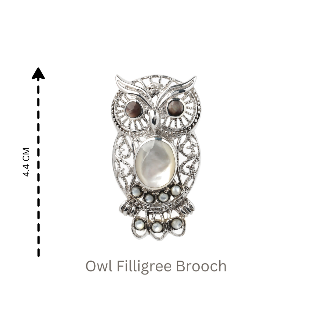 Artisan owl brooch with intricate silver filigree