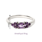 Elegant amethyst ring with 925 sterling silver band, featuring a central oval gemstone and accent stones