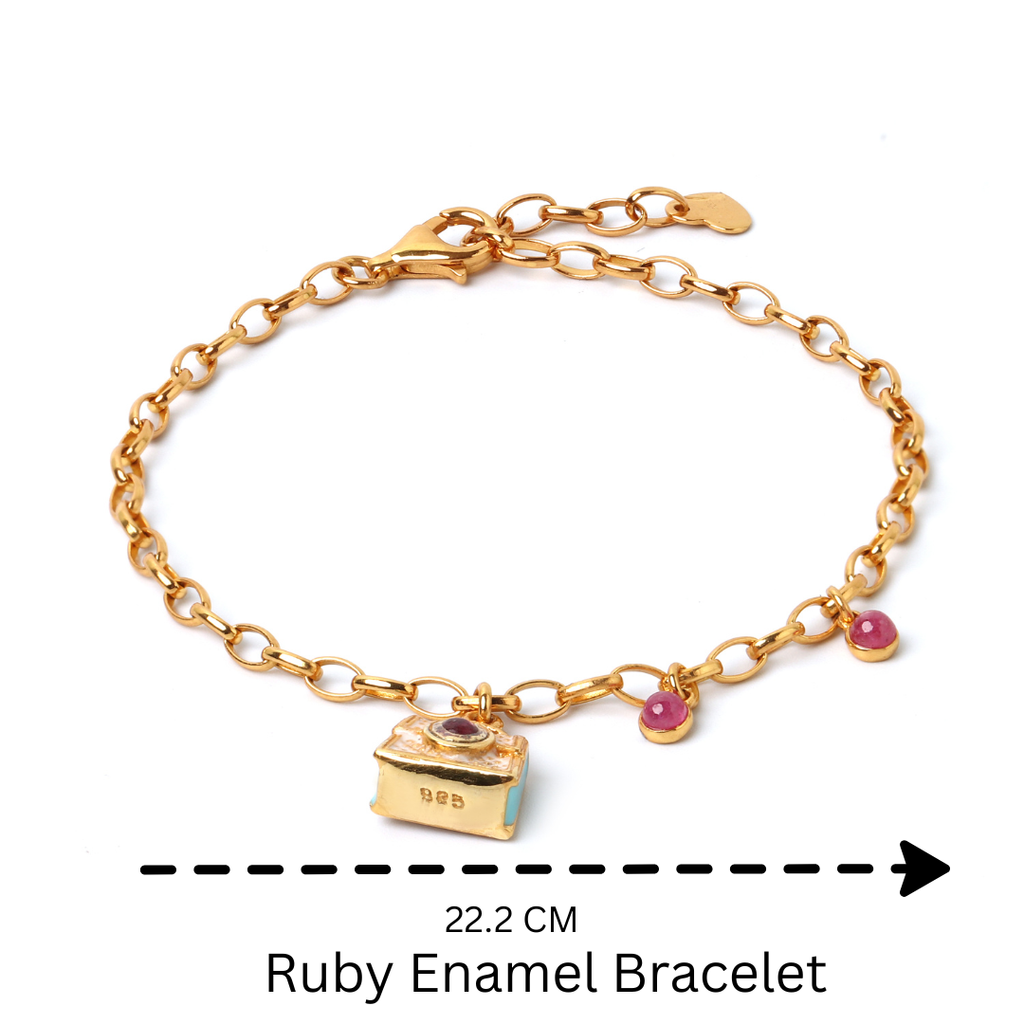 Minimalist ruby bracelet featuring artisan charm detailing