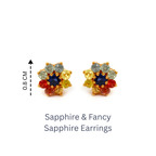 Colorful sapphire stud earrings with blue, yellow, red, and green gemstones in gold setting, 0.8 cm wide