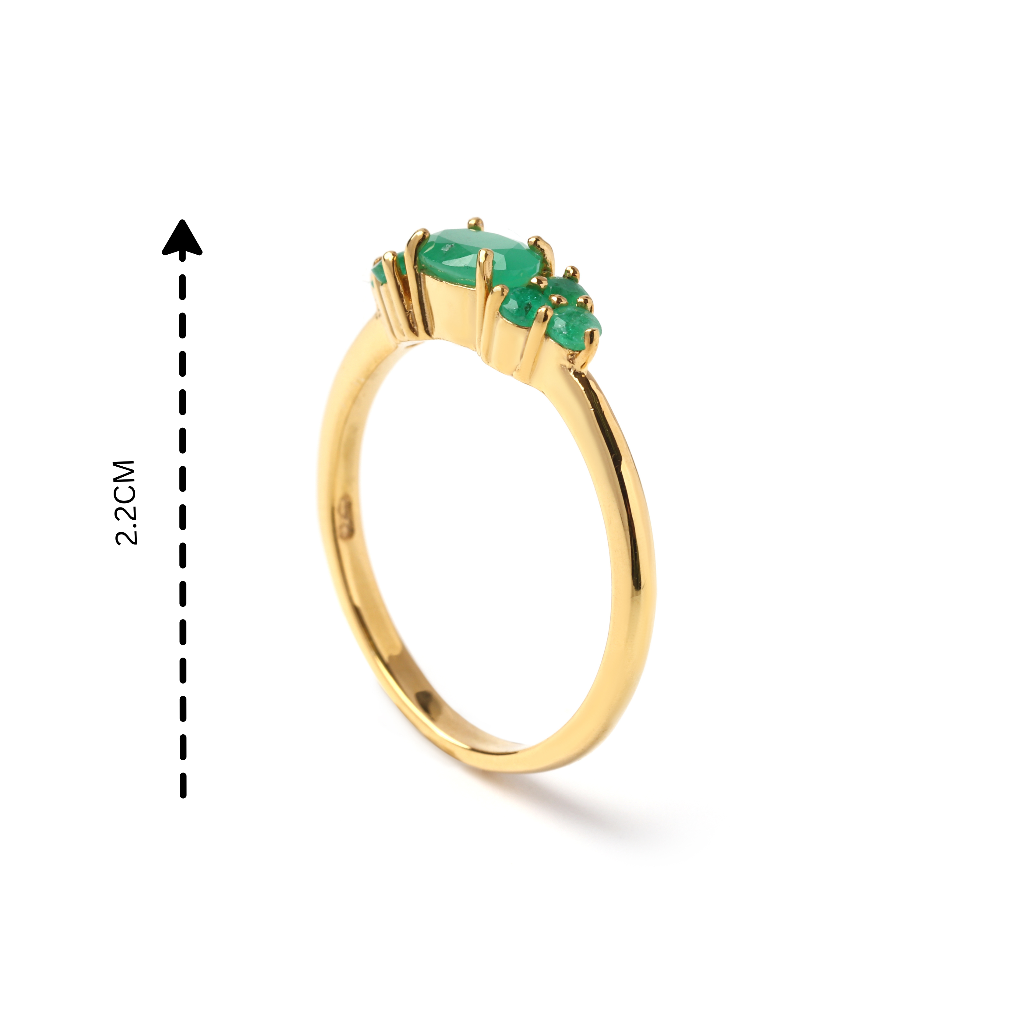 Detail view of prong-set emerald gemstones on gold finish 925 sterling silver ring