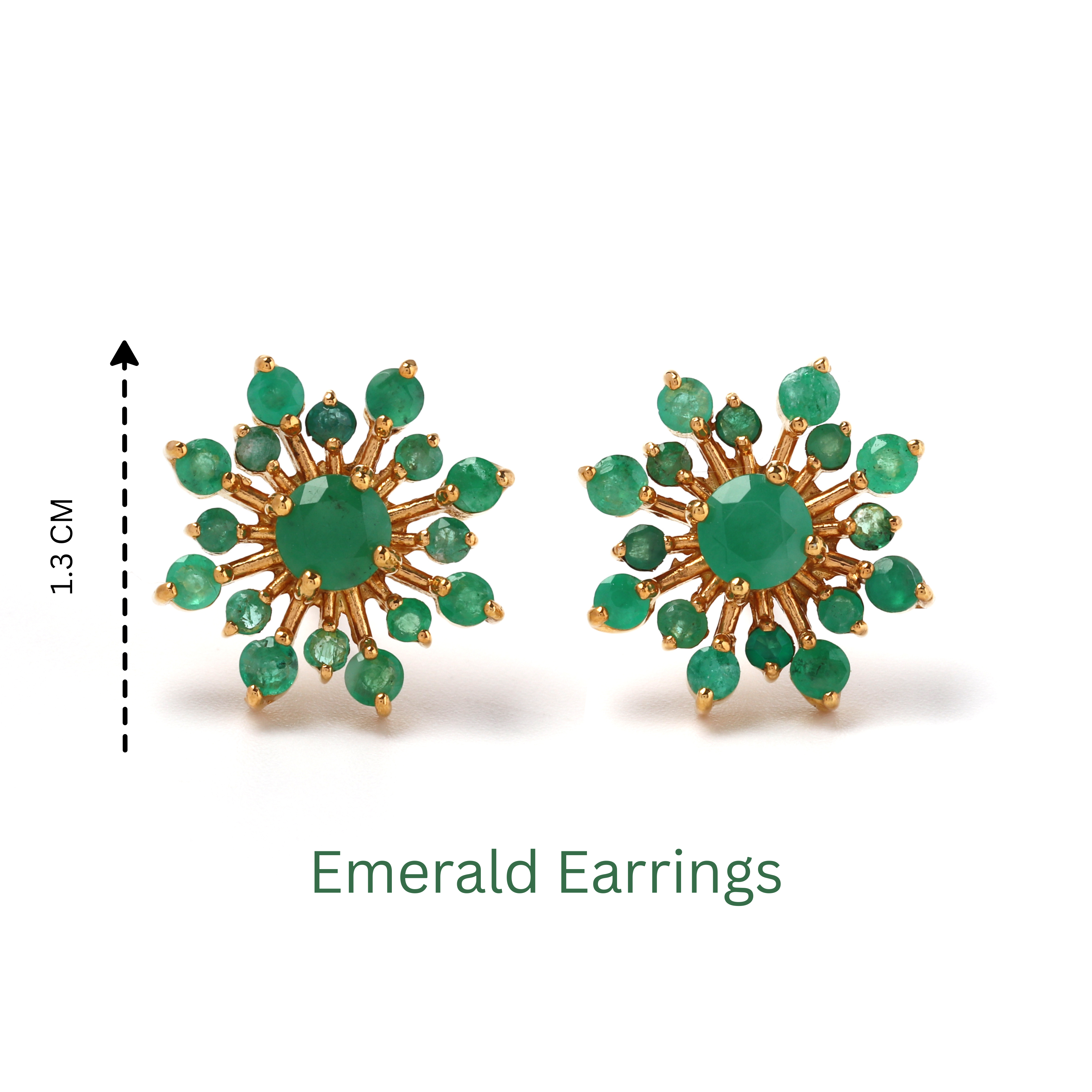 Detailed view of prong-set emerald gemstones in 925 sterling silver stud earrings with polished gold tone