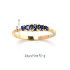 Gold sapphire ring with five blue gemstones, 0.3cm height, elegant band design