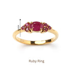 Elegant gold ring with oval ruby center and small ruby accents, 0.5cm height