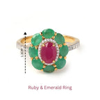 Elegant ruby and emerald ring with diamond accents, 1.3cm wide, crafted in gold-tone setting