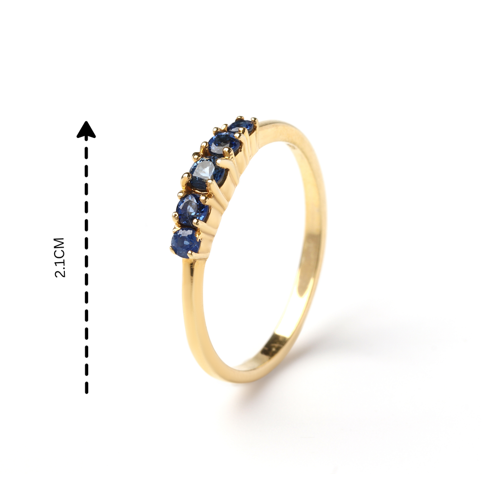 Detail view of prong-set blue sapphire gemstones on slim 925 sterling silver ring