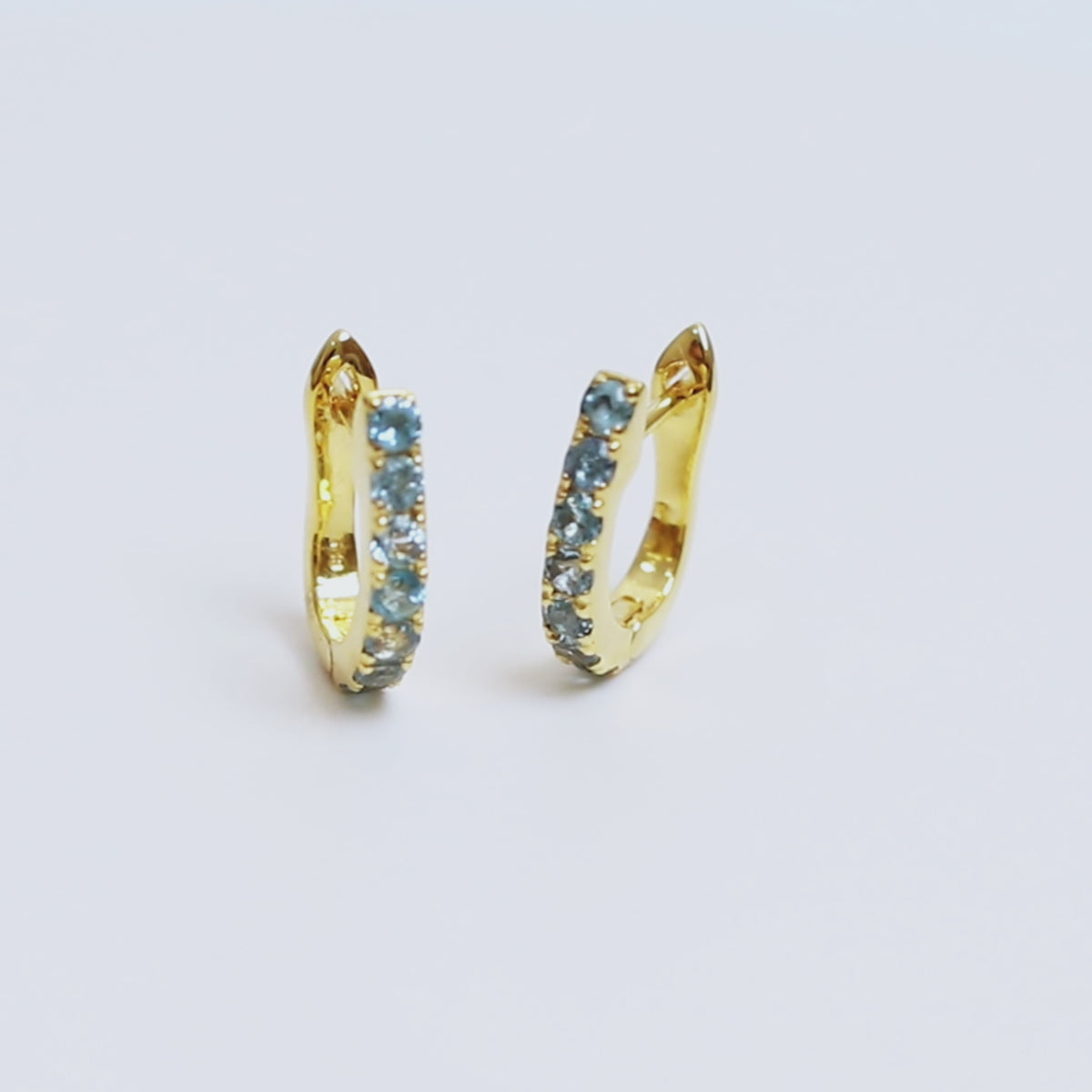 Blue Topaz Huggie Hoop Earrings in 18K Gold