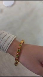 Women's gold plated multi gemstone bangle with geometric enamel design