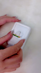 Handcrafted emerald ring with polished gold finish
