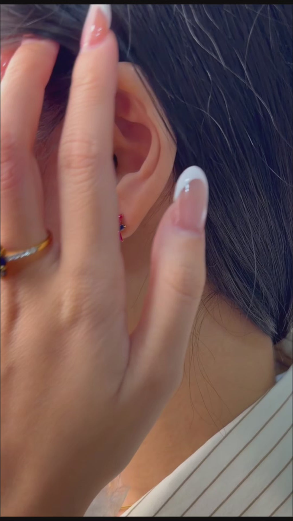 Luxury blue topaz stud earrings featuring colorful enamel details