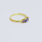 Anello Tanzanite a Sette Pietre in Oro 18K